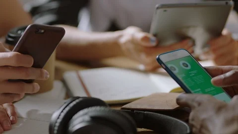 Business people students using tablet computer browsing smartphone studying Stock Footage 94439471