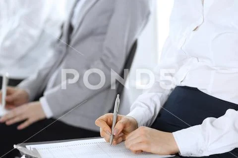 Business people taking part at conference or training at office, close-up. Women Stock Photos