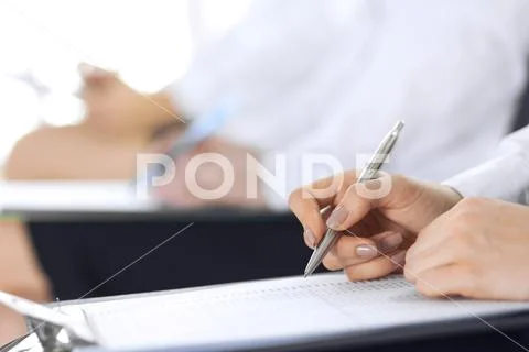 Business people taking part at conference or training at office, close-up. Women Stock Photos