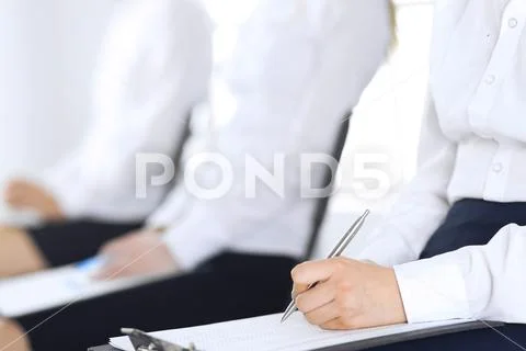Business people taking part at conference or training at office, close-up. Women Stock Photos