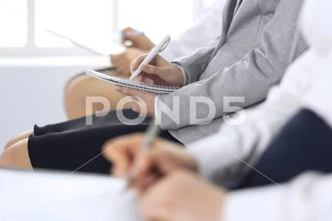 Business people taking part at conference or training at office, close-up. Women Stock Photos