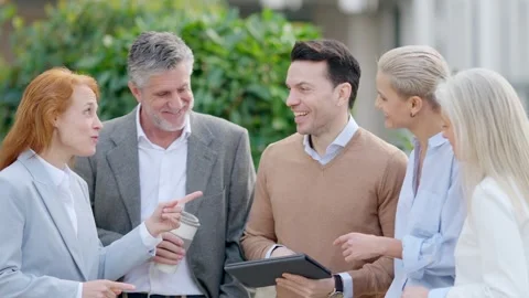 Business people talking all at the same time outdoors Stock Footage 244066431