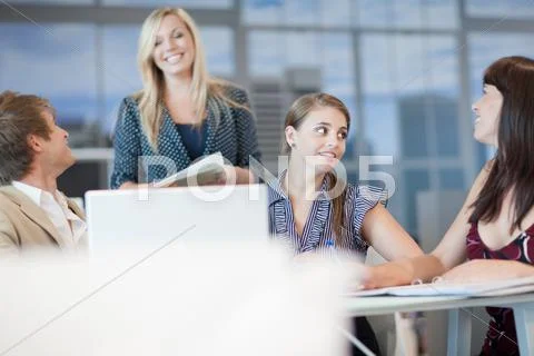 Business People Talking At Desk