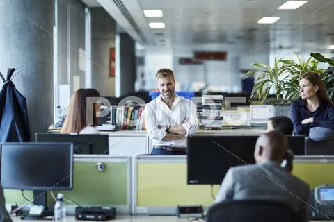 Business people talking in office cubicle Stock Photos