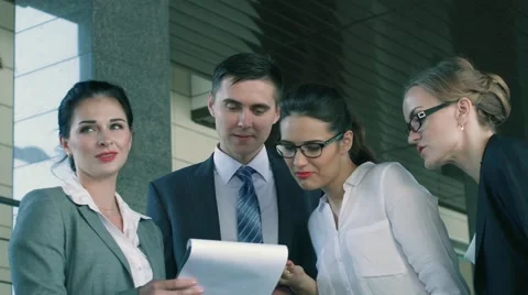 Business people talking over a business idea of their colleague Stock Footage