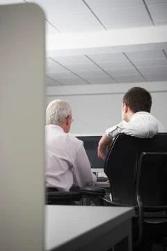Business People Using Computer In Cubicle Stock Photos