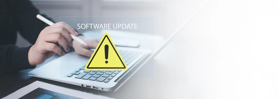 Business people using computer laptops with triangle caution warning signs, H Stockfoto's