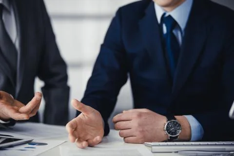 Business people using computer while working together in modern office. Unknown Stockfoto's