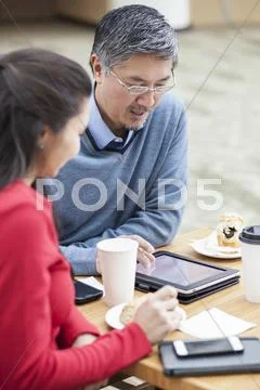 Business People Using Digital Tablet In Office