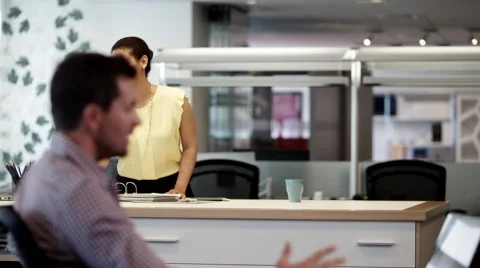 Business people using laptop and discussing at office. Stock Footage 63391935