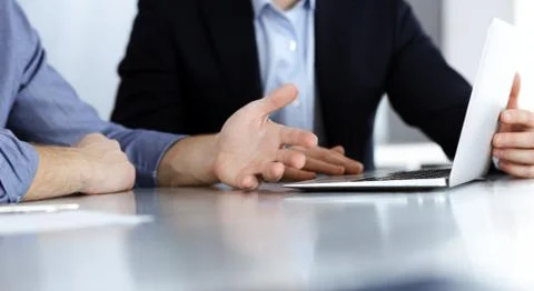 Business people using laptop computer while working together at the desk in Stock Photos