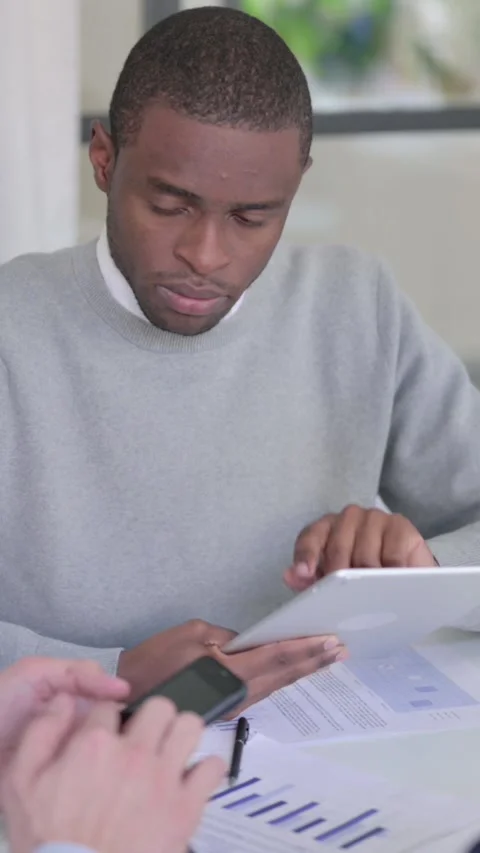 Business People using Tablet and Smartphone during Discussion, Vertical Video Stock Footage 340037887