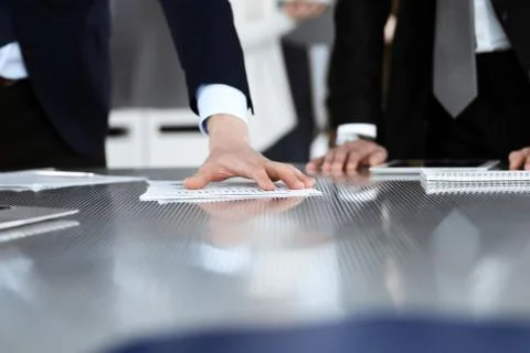 Business people using tablet computer while working together in a modern office Stock Photos