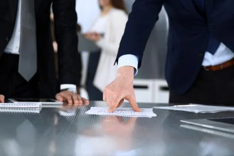 Business people using tablet computer while working together at the desk in Stock Photos
