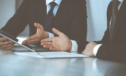 Business people using tablet computer while working together in modern office Stock Photos