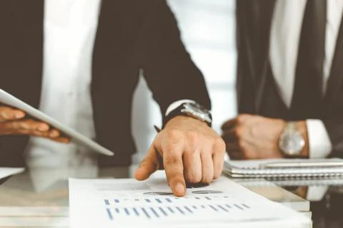Business people using tablet computer while working together in modern office Stock Photos