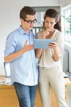 Business people using tablet PC Stock Photos