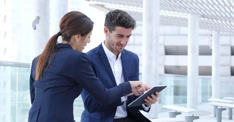 Business people using tablet together Stock Footage 83637643