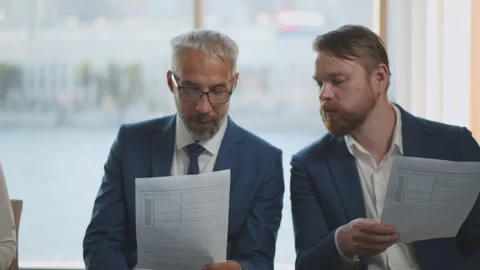 Business people waiting in queue and preparing for job interview reading cv Video stock 138219141