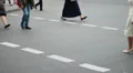 Business people walk on crossroad pedestrians, city daytime HD Footage
