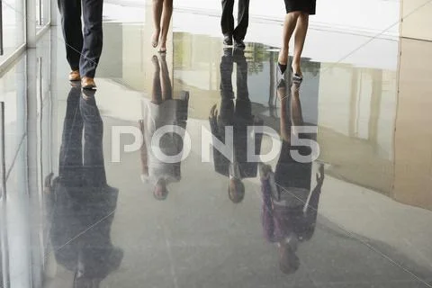 Business People Walking On Marble Flooring Stock Photos