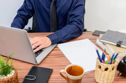 Business people work through notebook computers At the desk in the room Stock Photos