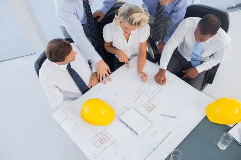 Business people working on construction plan Stock Photos
