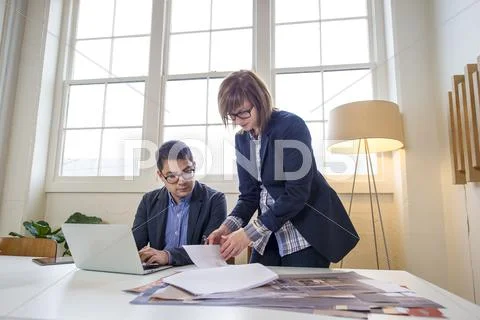 Business People Working At Desk In Office