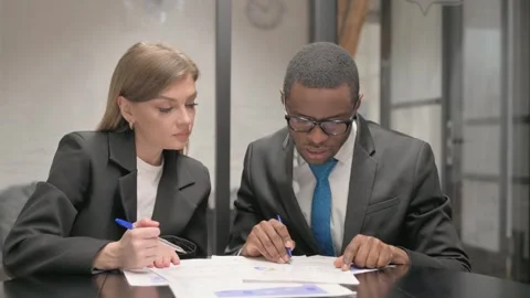 Business People Working on Documents in Office Stock Footage 302869719