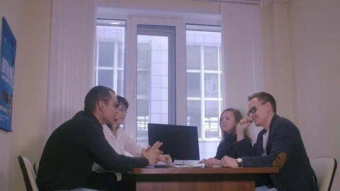 Business people working together on a document during a meeting in an office Stock Footage 82579423