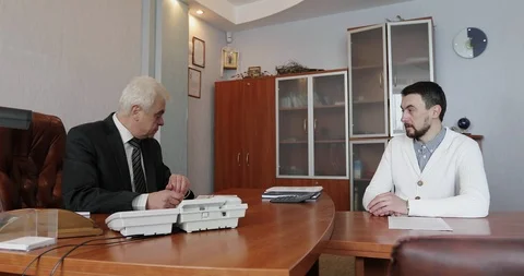 Business people working together on a document during a meeting in an office. Stock Footage 86490864
