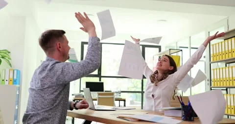 Business people working together throwing papers and papers flying in air Stock Footage 288081033