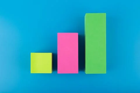 Business performance chart with multicolored bars with rise dynamic against blue Stock Photos