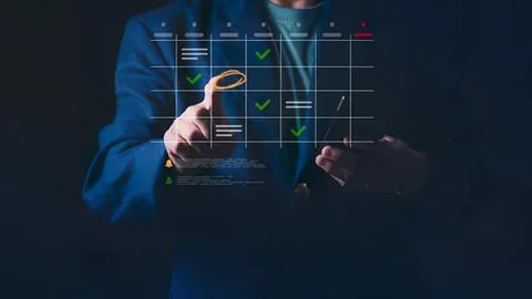 Business person checking digital task list on transparent screen Stock Photos