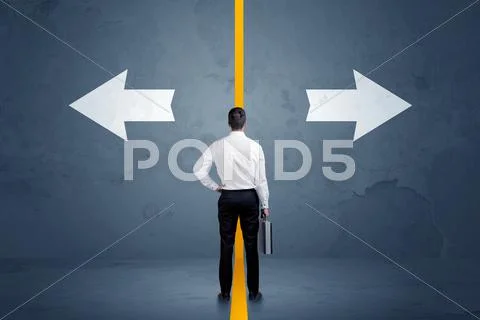 Business person choosing between two options separated by a yellow border arr Stock Photos