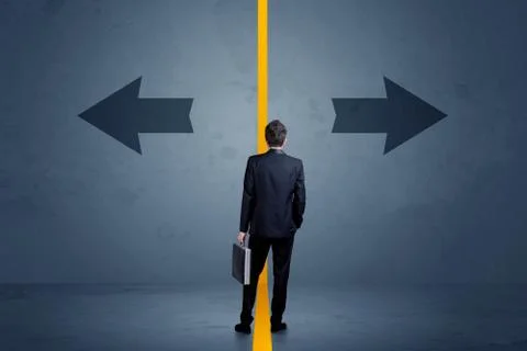 Business person choosing between two options separated by a yellow border arr Stock Photos