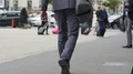 Business person holding bag and walking to airport, travel, slow motion video HD Footage