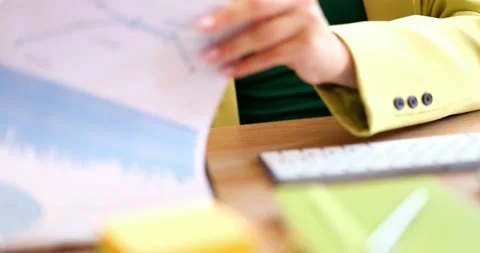 Business person leafing through documents with financial analytics indicators Video stock 203828808
