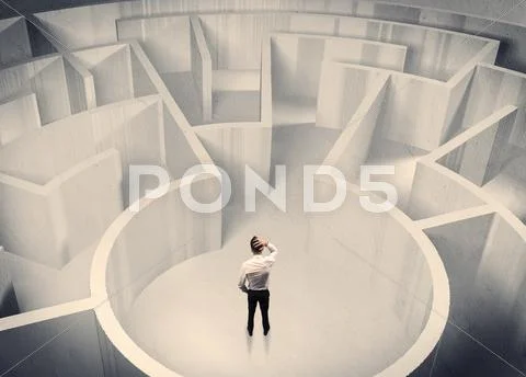 Business person standing in maze center Stock Photos