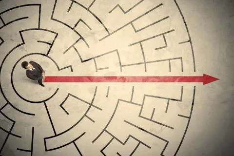 Business person standing in the middle of a circular maze Stock Photos