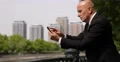 Business Person Using Digital Tablet City Street Outdoors Man Surfing Internet 4k or 4k+ Resolution