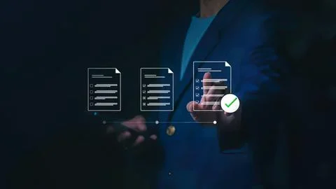 Business person using digital tablet with documents and checkmarks Stock Photos