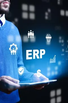 Business person using ERP software with graphics in dark environment for Stock Photos
