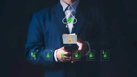 Business person using smartphone with cloud security icons 库存照片