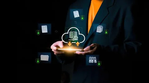 Business person using tablet with cloud data storage icons Foto stock