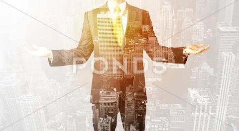 Business person with warm color overlay of city background Stock Photos