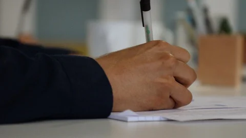 Business persons hand writing notes during a meeting 스톡 동영상 93518312
