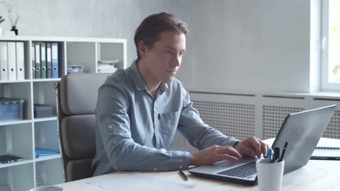 Business persons is work alone in modern office using computer technology Video stock 142589712