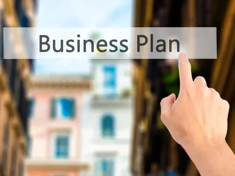 Business Plan - Hand pressing a button on blurred background concept on visua Foto stock