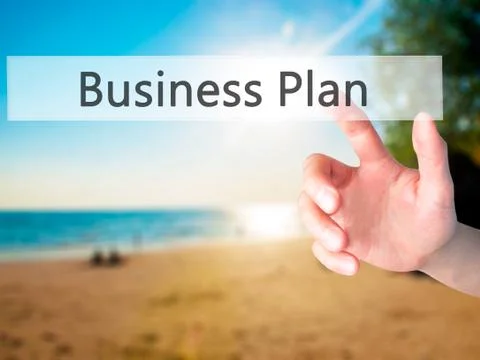 Business Plan - Hand pressing a button on blurred background concept on visua Stock-Fotos